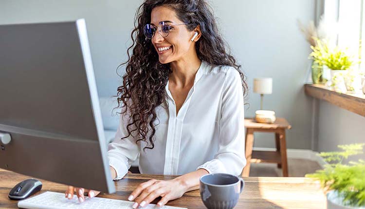 Shot of a young businesswoman working on a computer in an office. Offers that serve self study program